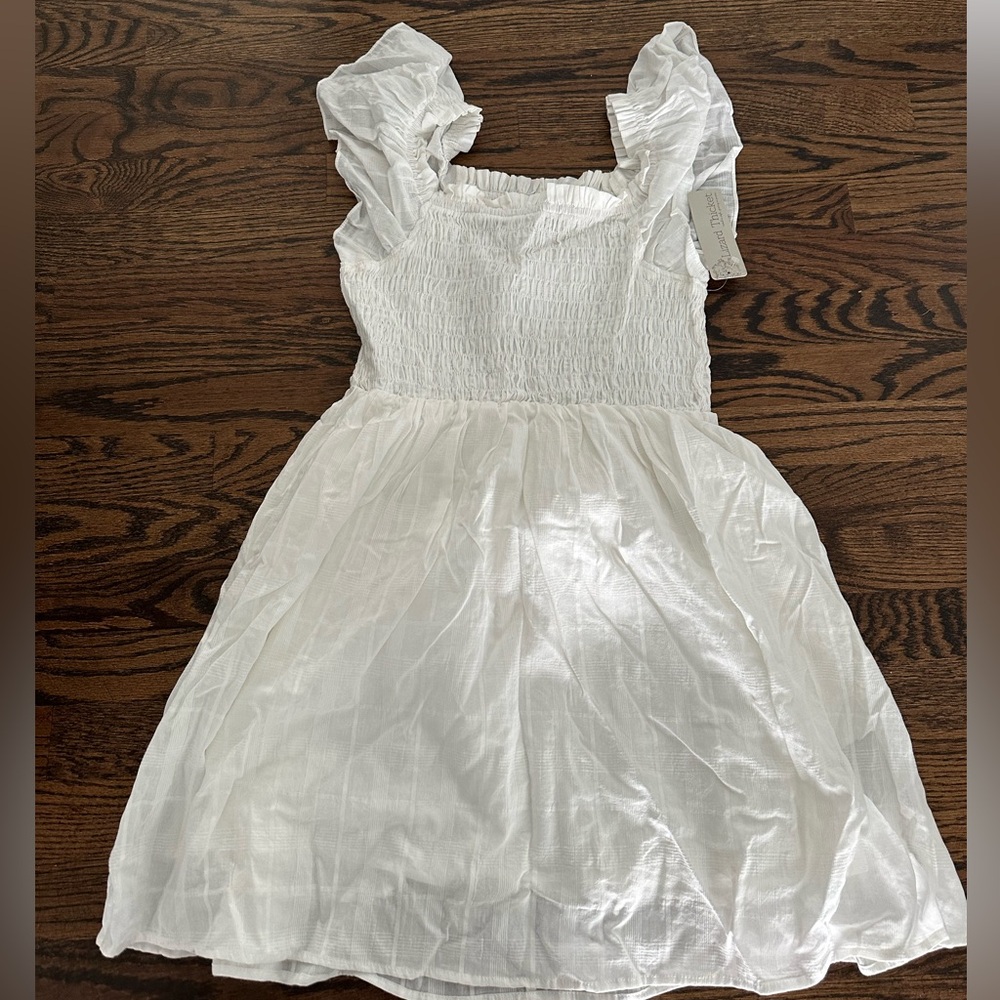 White dress from a boutique. Super cute never worn, with tags